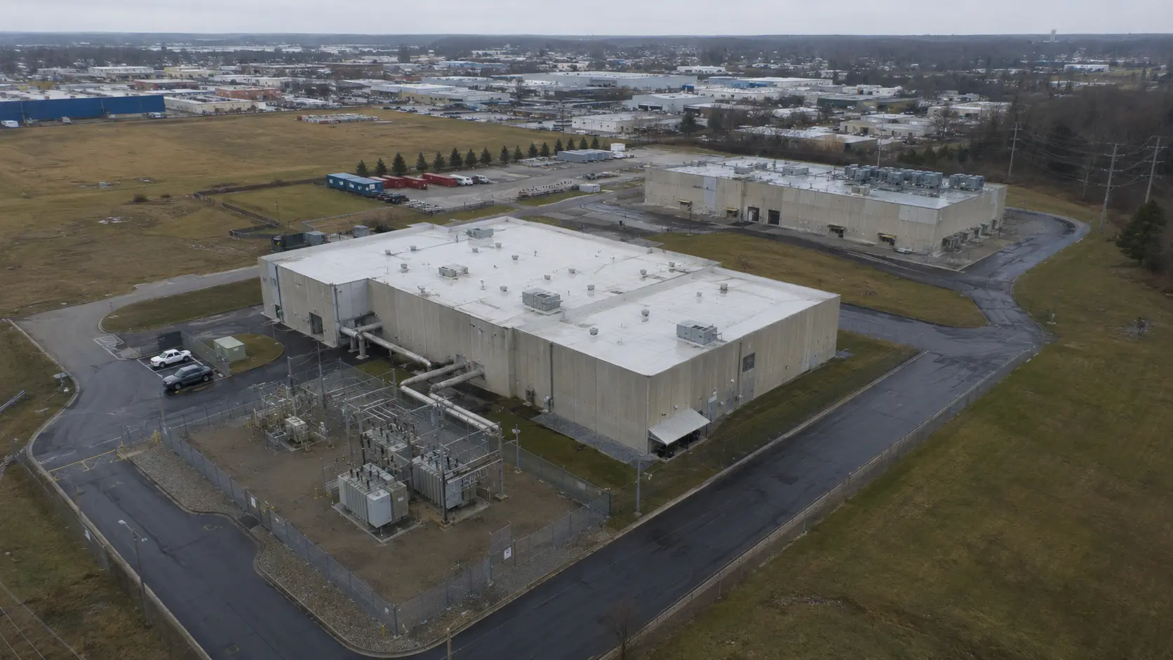 Illustrative aerial view of a practical data center campus and electrical substation